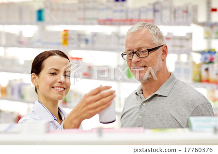 pharmacist showing drug to senior man at pharmacy pharmacist showing drug to senior man at pharmacy 17760376