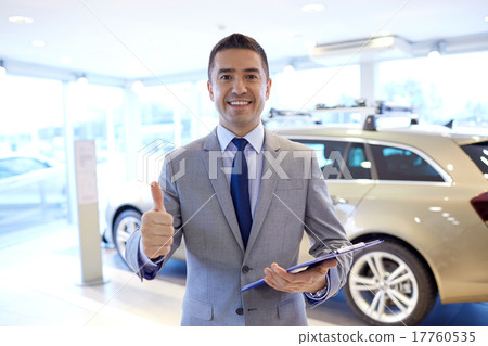 happy man at auto show or car salon happy man at auto show or car salon 17760535