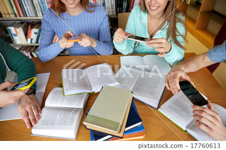 students with smartphones making cheat sheets students with smartphones making cheat sheets 17760613