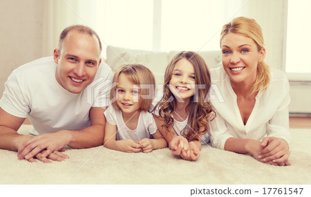 parents and two girls lying on floor at home parents and two girls lying on floor at home 17761547