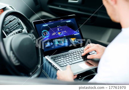 man using navigation on laptop computer in car man using navigation on laptop computer in car 17761970