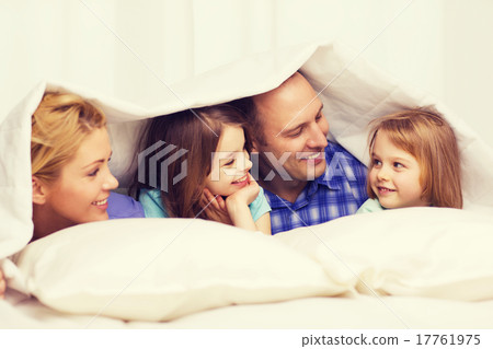 happy family with two kids under blanket at home 17761975