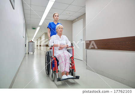 nurse with senior woman in wheelchair at hospital nurse with senior woman in wheelchair at hospital 17762103
