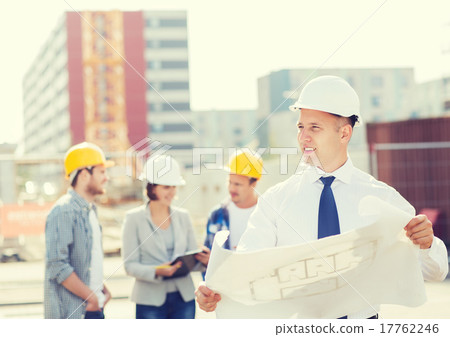 group of builders with tablet pc and blueprint 17762246