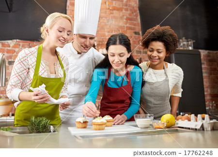 happy women and chef cook baking in kitchen 17762248