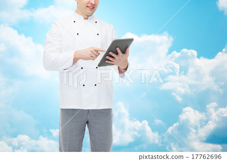 close up of happy male chef cook holding tablet pc close up of happy male chef cook holding tablet pc 17762696
