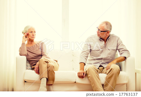 senior couple sitting on sofa at home senior couple sitting on sofa at home 17763137