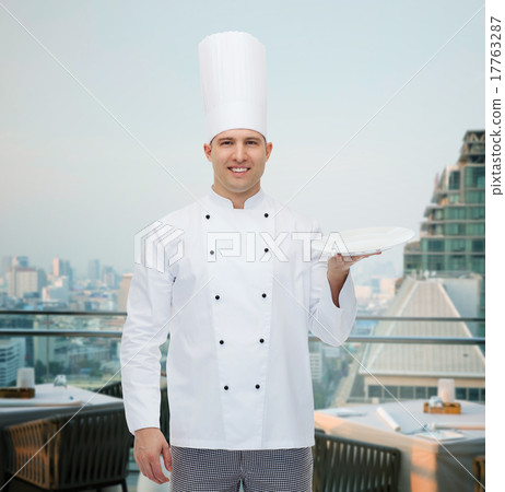 happy male chef cook showing empty plate happy male chef cook showing empty plate 17763287