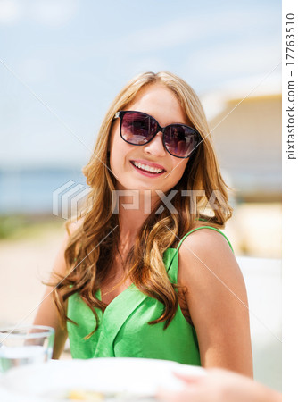 girl in shades in cafe on the beach girl in shades in cafe on the beach 17763510