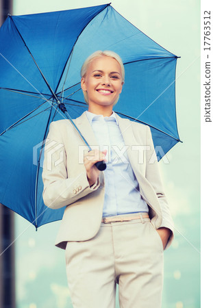 young smiling businesswoman with umbrella outdoors young smiling businesswoman with umbrella outdoors 17763512