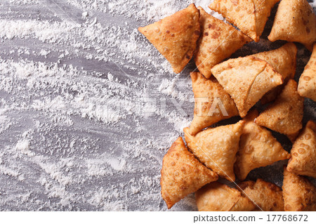 Indian samosa pastry on a floured table. top view 17768672
