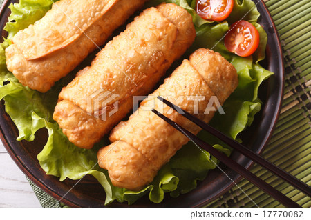spring rolls fried on lettuce top view 17770082