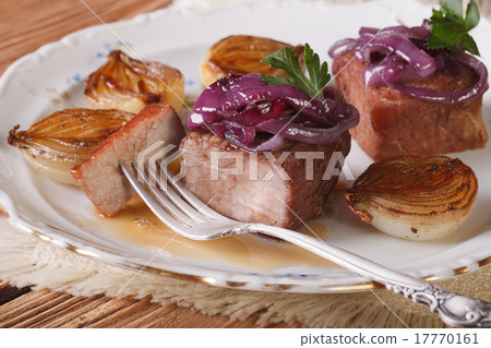 Meat with caramelized onions and sauce closeup 17770161