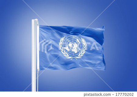 Flag of the United Nations waving against sky. 17770202