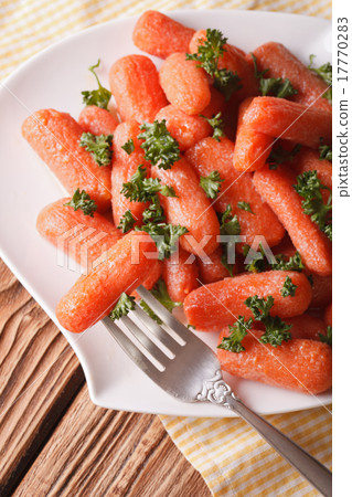 glazed baby carrots with parsley on a plate  17770283