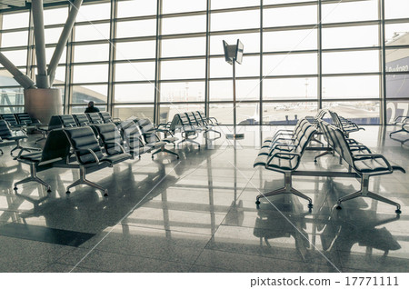 airport waiting area, seats and outside the window airport waiting area, seats and outside the window 17771111