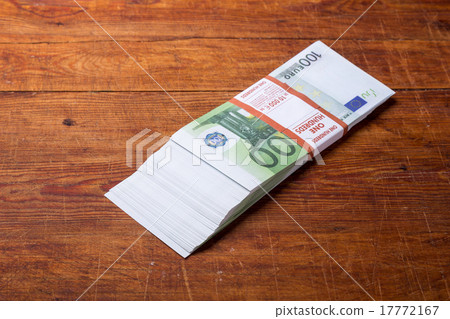 Close-up of 100 Euro banknotes on wood background Close-up of 100 Euro banknotes on wood background 17772167