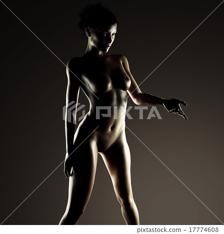 Beautiful naked young woman in the dark studio 17774608