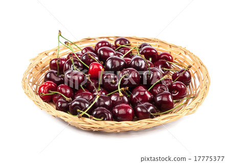 Fruits of sweet cherries in a wicker plate. 17775377