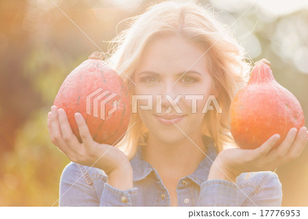 Beautiful woman harvesting pumpkins 17776953