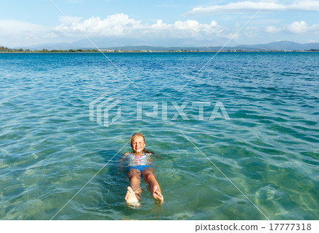 Happy girl in sea 17777318
