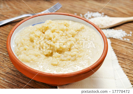 four cheese risotto on a wooden table 17778472