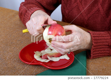 Apple in old woman hands Apple in old woman hands 17779224