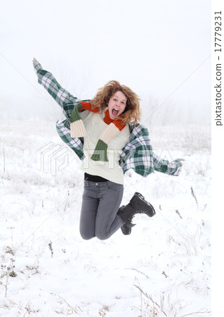 Jumping girl in a cold winter day 17779231