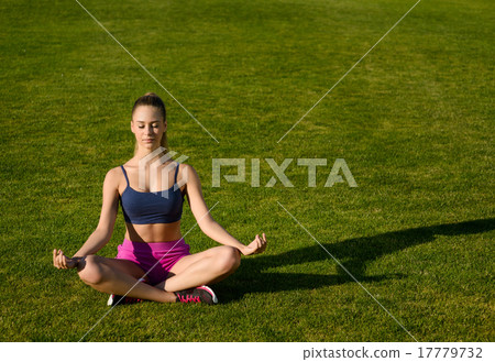 Girl doing yoga on the nature. Girl doing yoga on the nature. 17779732
