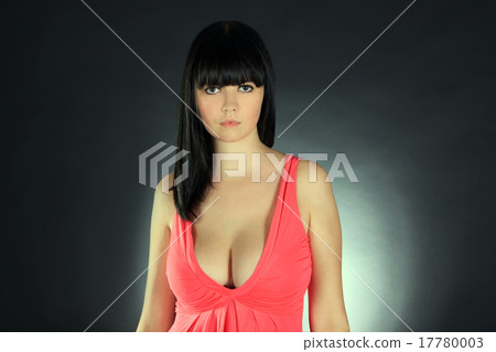 Fashion female in pink dress posing in the Fashion female in pink dress posing in the 17780003