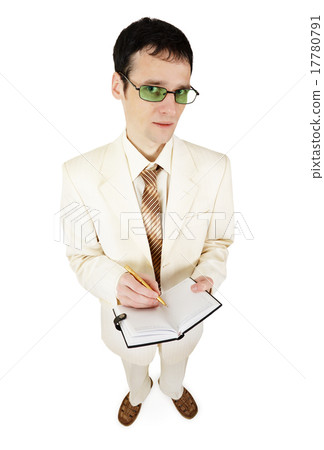 Young businessman in light suit writes in notebook Young businessman in light suit writes in notebook 17780791