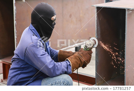 Electric wheel grinding on steel structure  17781257