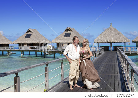 Lovers, man and woman on a wooden path at the sea, Lovers, man and woman on a wooden path at the sea, 17798274