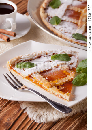 Piece of Italian tart with apricot jam and coffee Piece of Italian tart with apricot jam and coffee 17801705