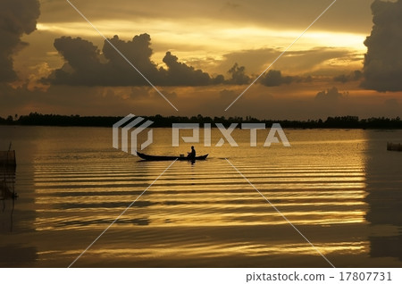 People with  row boat on river  at sunrise 17807731