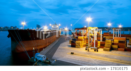 very large ship in the port during cargo operation very large ship in the port during cargo operation 17810175