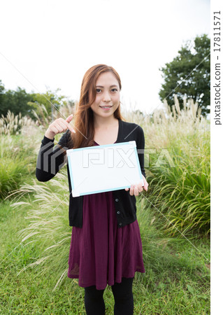 A woman with a white board A woman with a white board 17811571