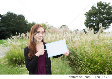 A woman with a white board A woman with a white board 17811572
