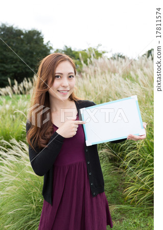 A woman with a white board A woman with a white board 17811574