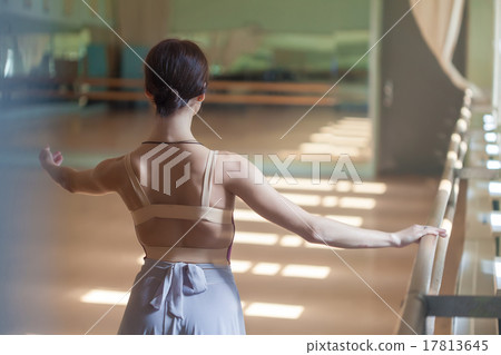classic ballet dancer posing at barre on rehearsal classic ballet dancer posing at barre on rehearsal 17813645
