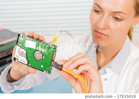 Electronics repair tech fixes curcuit board Electronics repair tech fixes curcuit board 17815619