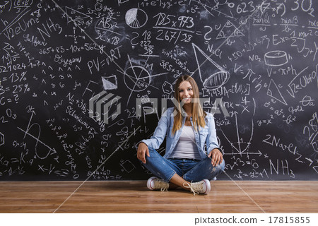 Beautiful young girl in front of blackboard     17815855