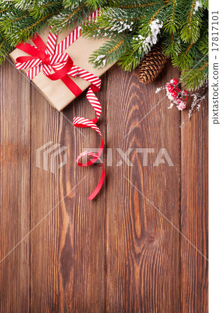 Christmas background with fir tree and gift box Christmas background with fir tree and gift box 17817101