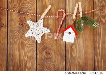 Snow fir tree and christmas decor on rope Snow fir tree and christmas decor on rope 17817102