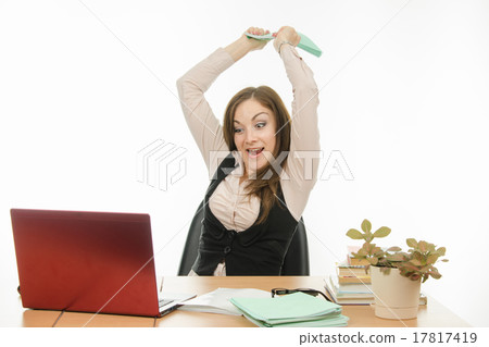 The teacher has a book on a laptop 17817419