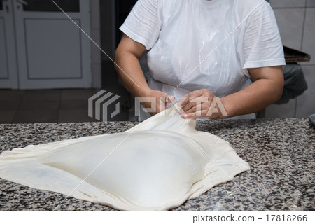 female hands kneading dough and making banitsa female hands kneading dough and making banitsa 17818266