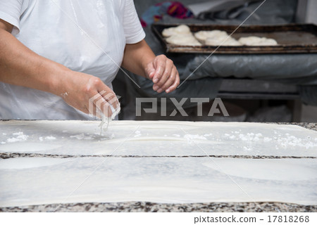 female hands kneading dough and making banitsa female hands kneading dough and making banitsa 17818268