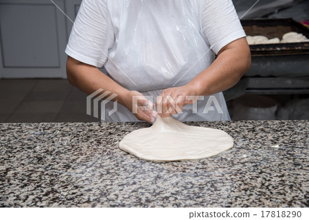 female hands kneading dough and making banitsa female hands kneading dough and making banitsa 17818290