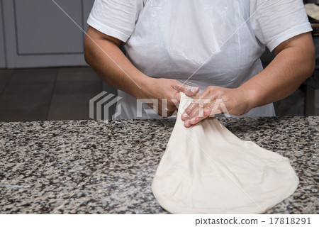 female hands kneading dough and making banitsa 17818291