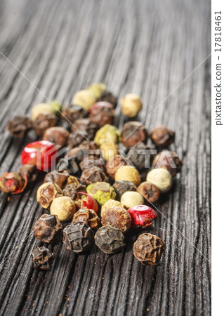 pepper corns on a wooden board pepper corns on a wooden board 17818461